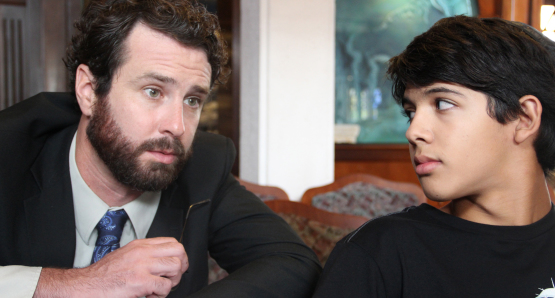 Josh (Luca Oriel) and Rabbi Brookstein (Sean McConaghy) meeting for the first time.