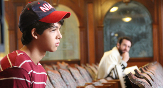 Josh (Luca Oriel) and Rabbi Brookstein (Sean McConaghy) at the synagogue.